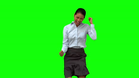 Happy-businesswoman-gesturing-on-green-screen