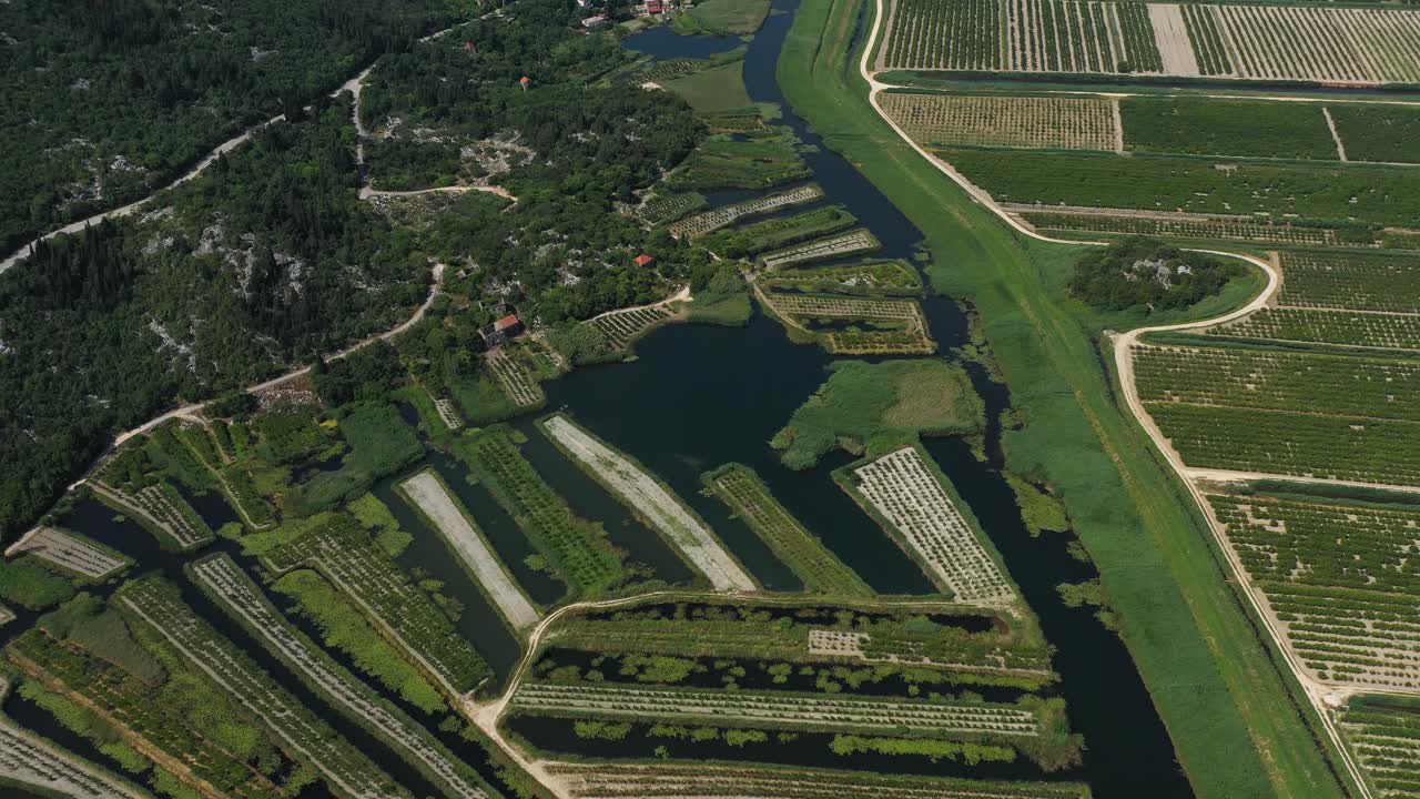 Neretva Valley, flying over Agriculture Plantation Fields in Delta of River Neretva in South Croatia - Aerial Drone View