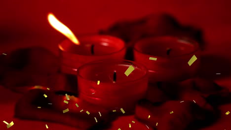 animación de confeti dorado sobre velas rojas