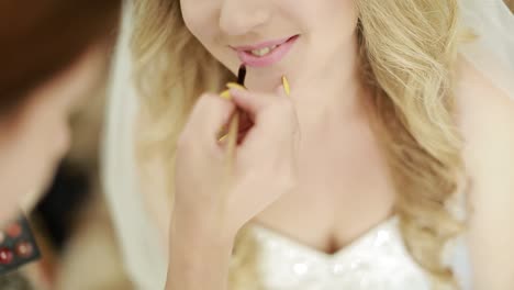 bride morning on the wedding day. wedding makeup. makeup artist made makeup for beautiful bride at wedding day