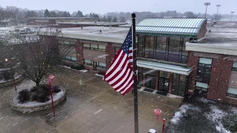 Close-up-of-American-flag-during-snow-storm