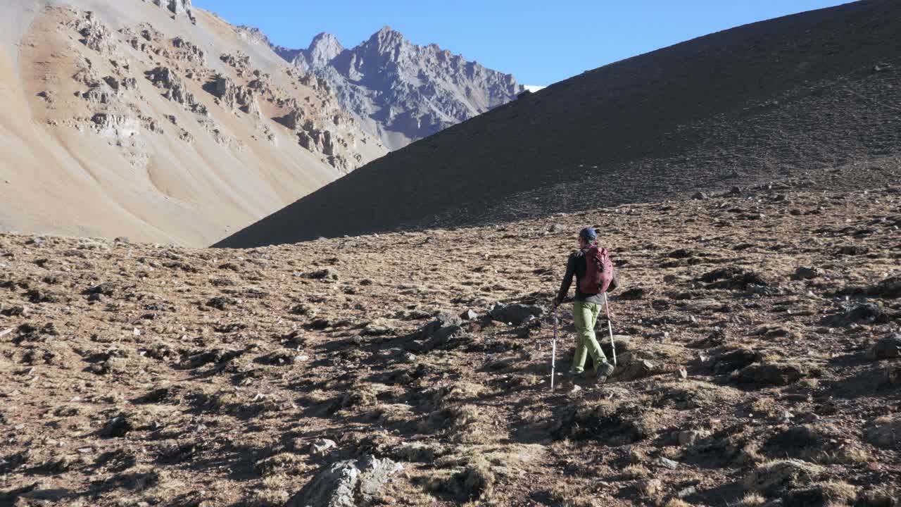 Man hiking in the Andes mountains at high altitude. Mendoza, Argentina. penitentes traverse.