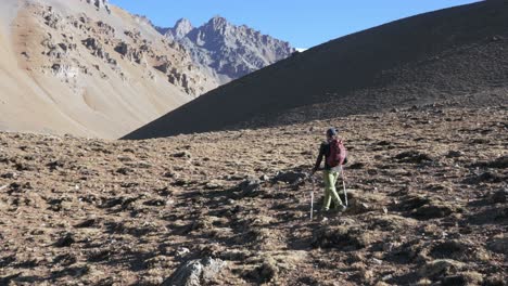 man hiking in the andes mountains at high altitude. mendoza, argentina. penitentes traverse.