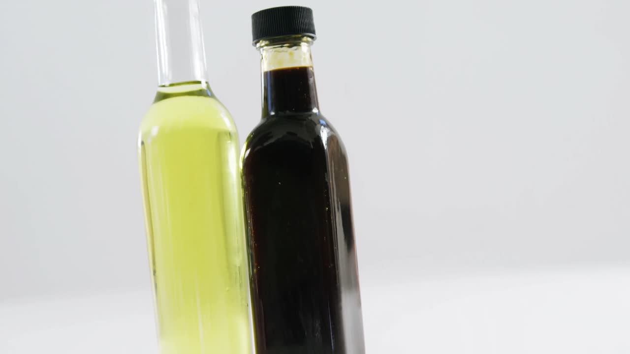 Two bottles of olive oil and extra virgin olive