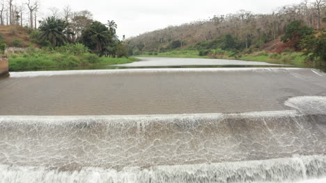 traveling front over a river, dam on a river in angola, africa 7