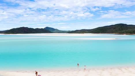 drone shot of people on beautiful sandy beach at whitehaven beach whitsunday island australia