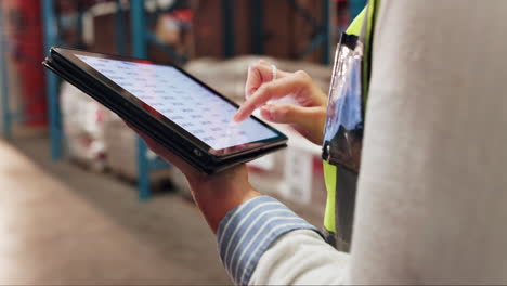 woman using tablet in a warehouse for inventory management