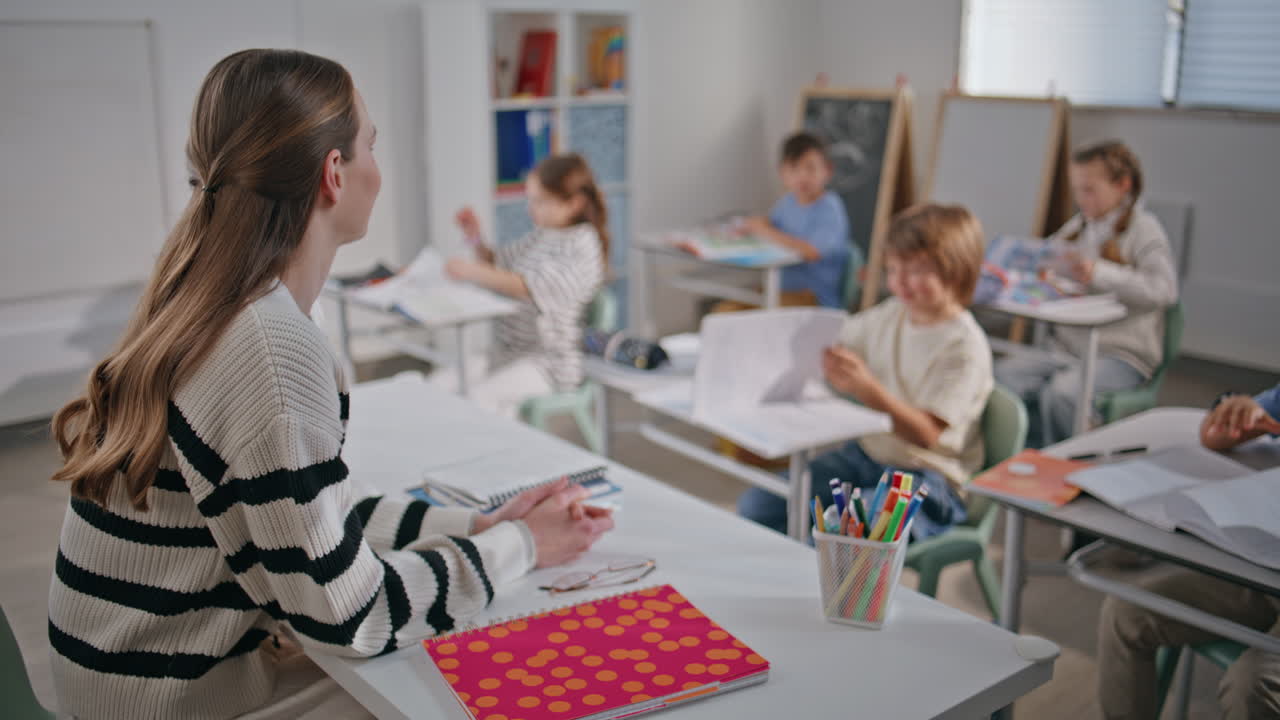 Group pupils learning school classroom closeup. Classmates sitting desks smiling