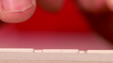 extreme close-up of fingers typing on computer keyboard