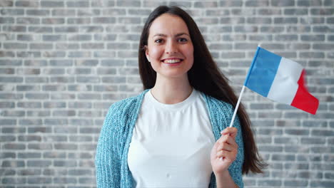 woman holding french flag