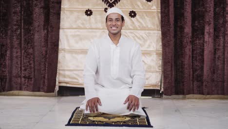 happy and smiling indian man looking at the camera