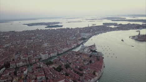 Wide-aerial-panorama-shot-of-San-Marco-area-from-above-at-dusk,-Venice,-Italy