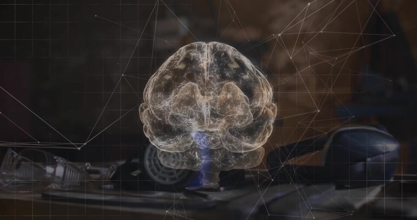 On appearing above tool bench, translucent brain hologram rotating to showcase network grid overlay