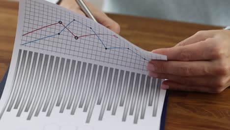 a person analyzing financial reports or business data