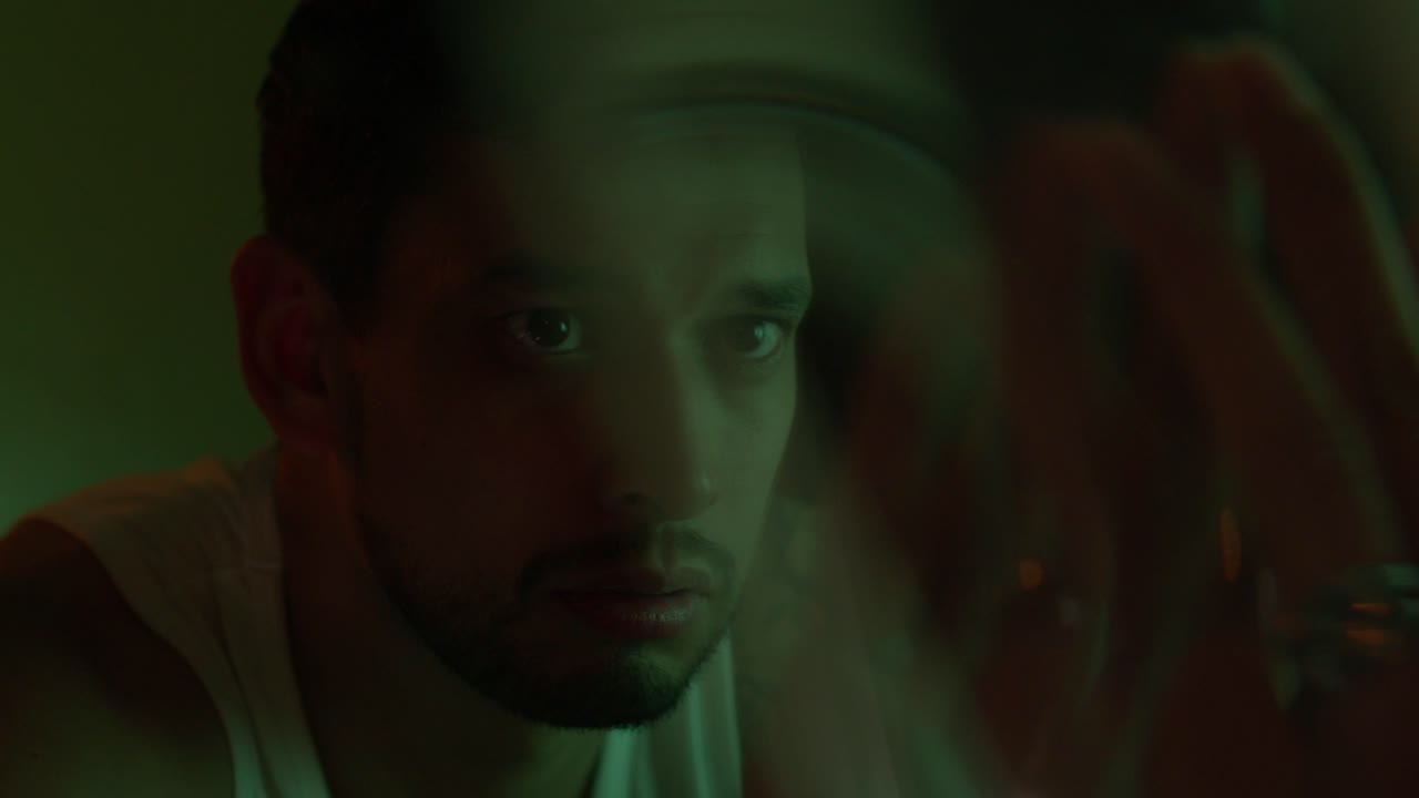 Portrait of a man in green light