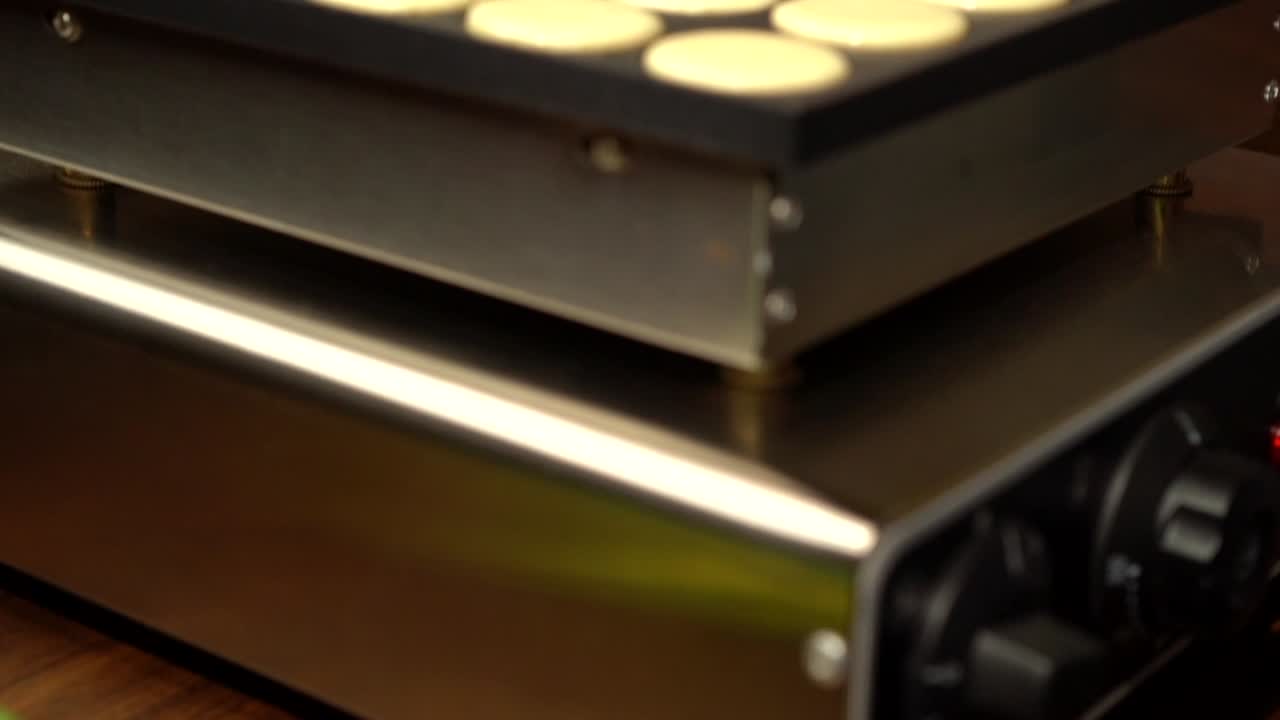 Tilt shot pancakes hotcakes mini maker dough preparation