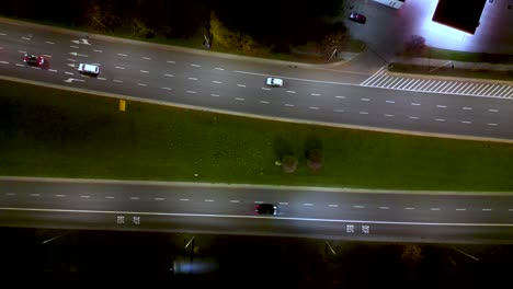 Rising-drone-shot-reveals-spectacular-elevated-highway-and-convergence-of-roads,-bridges,-viaducts-at-night,-transportation-and-infrastructure-development