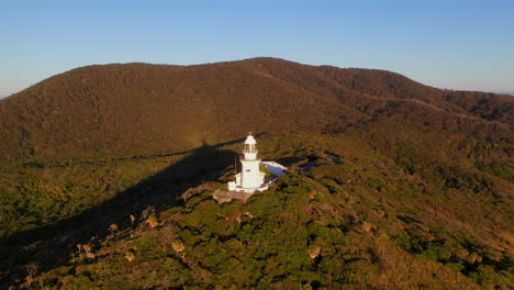 cinematic rotating drone shot around smoky cape lighthouse in australia