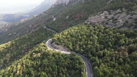 Beaufitul scenic aerial shot following the famous SS 125 road through the mountains in Sardinia, Italy.