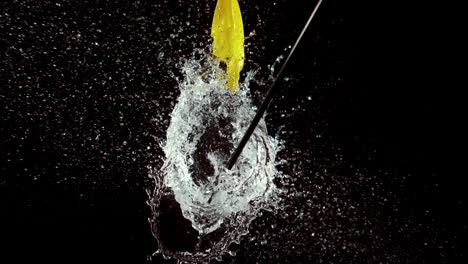 arrow bursting a water balloon