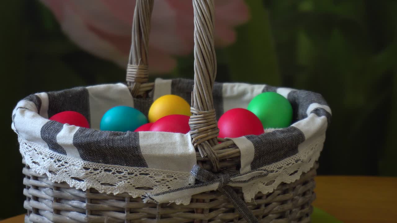 Basket with multi-colored Easter eggs