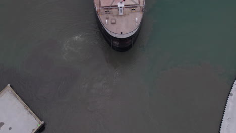 aerial reveal of a bulk carrier departing from kingsville harbour