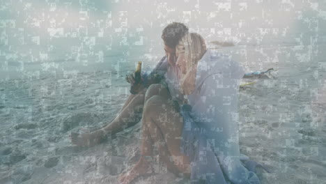 couple sitting on sandy beach with digital data processing animation overlay