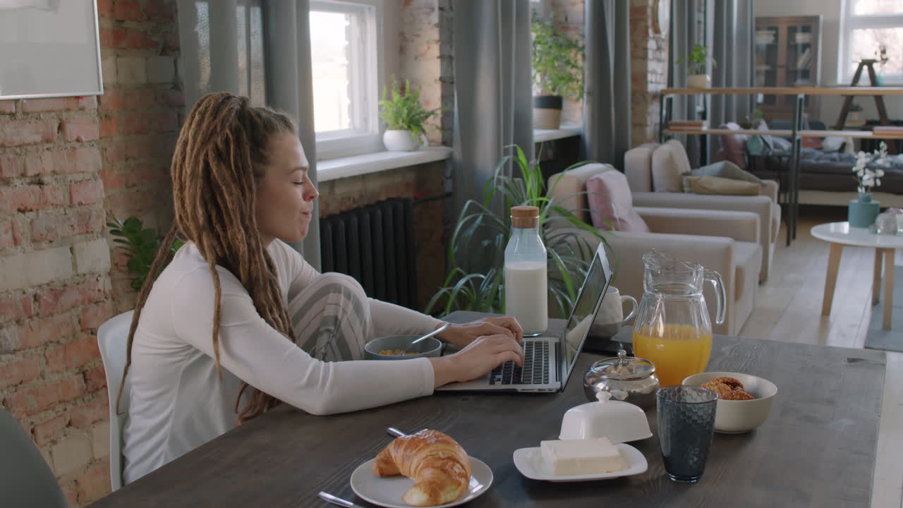Woman Working Online During Breakfast