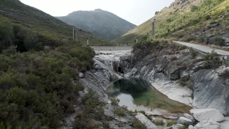 Aerial-footage-of-geres-sete-lagoas-national-park-northern-Portugal-lake-rock-formation-in-mountain-landscape