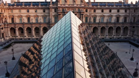 louvre museum pyramid at sunrise