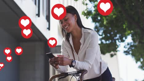 animation of love heart icons over woman using smartphone in city