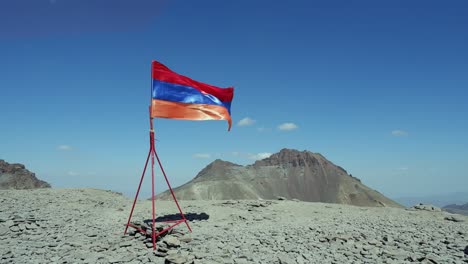 Shiny-Armenian-flag-flutters-in-wind-on-summit-peak-of-Mount-Aragats