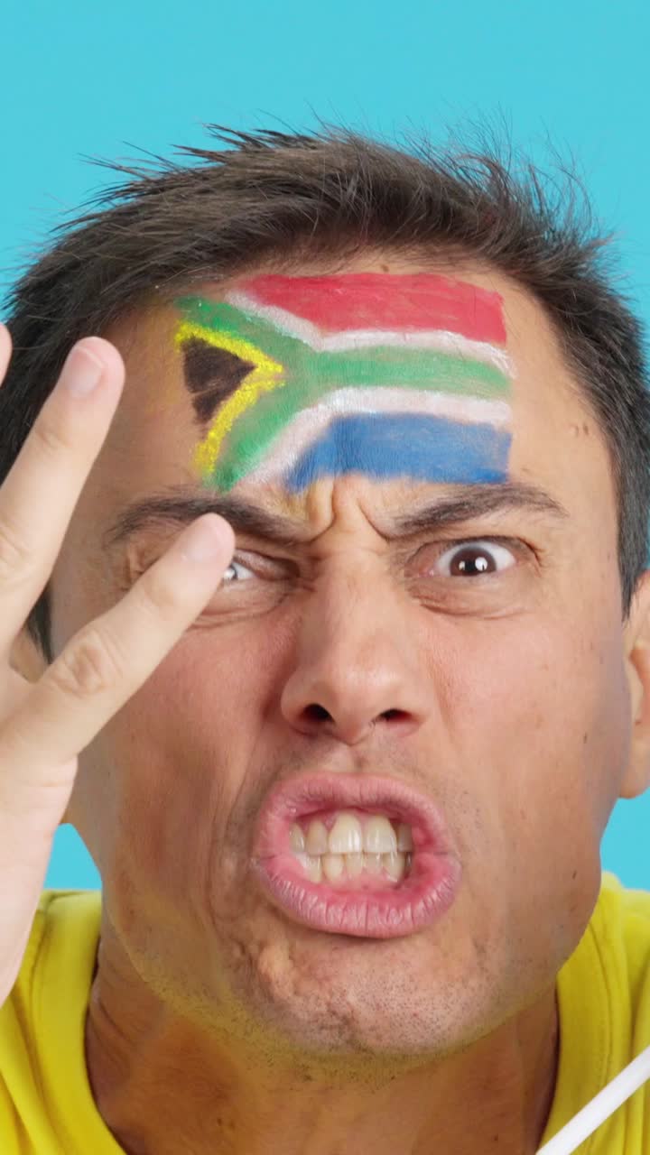 Man with south african national flag upset with a referee