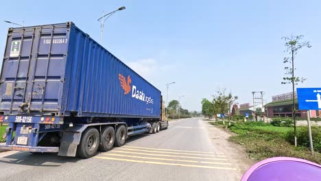 large truck driving on a rural road