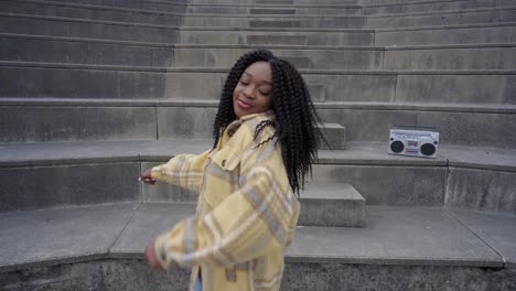 Black-woman-listening-to-music-and-dancing