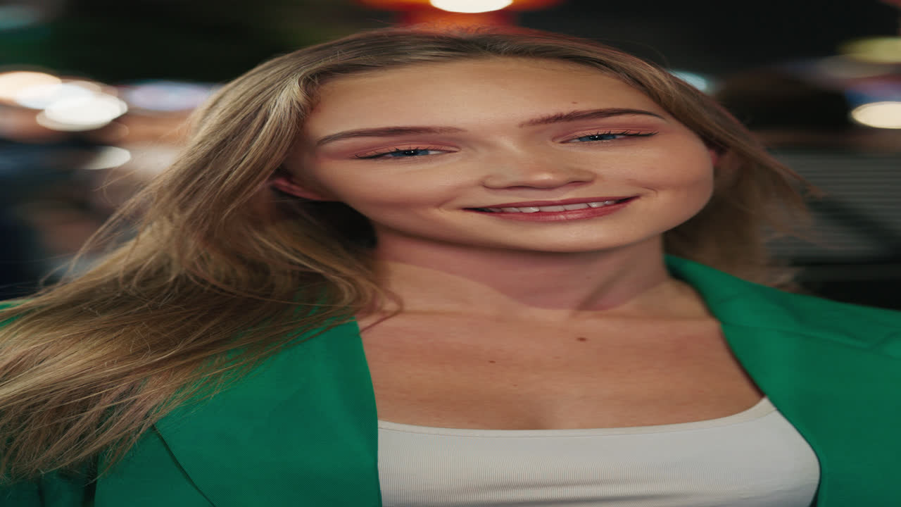 Young Woman Smiling Outdoors at Night