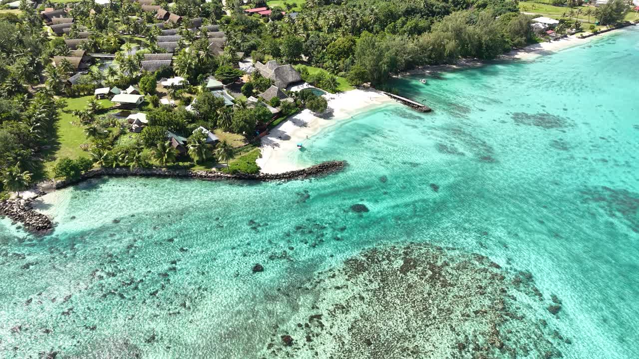 Aerial View of Huahine Island, French Polynesia. Fare Village Beach and Buildings, Turquoise Ocean and Landscape
