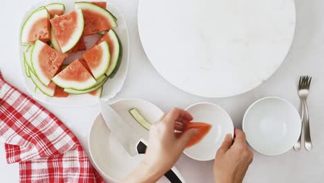 watermelon fruit salad in a bowls, close up view from above, white background