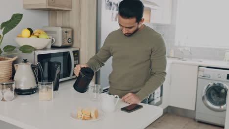 man at table in kitchen make coffee for energy