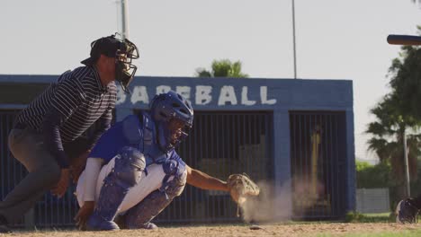 baseball player catching a ball during a match