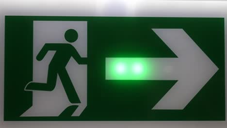 Green color right direction arrow sign flashing