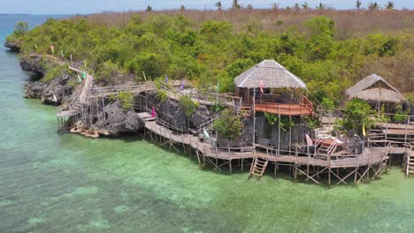 aerial pullout over shelters and walkway built over water in philippines