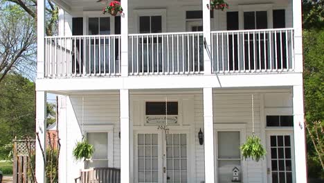 A-Charming-Old-House-In-The-Country-With-A-Welcoming-Secondstory-Porch