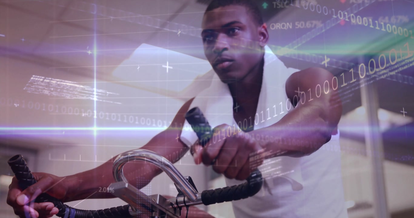 Gym user gripping handlebars and pedaling stationary bike activating data overlay while using towel