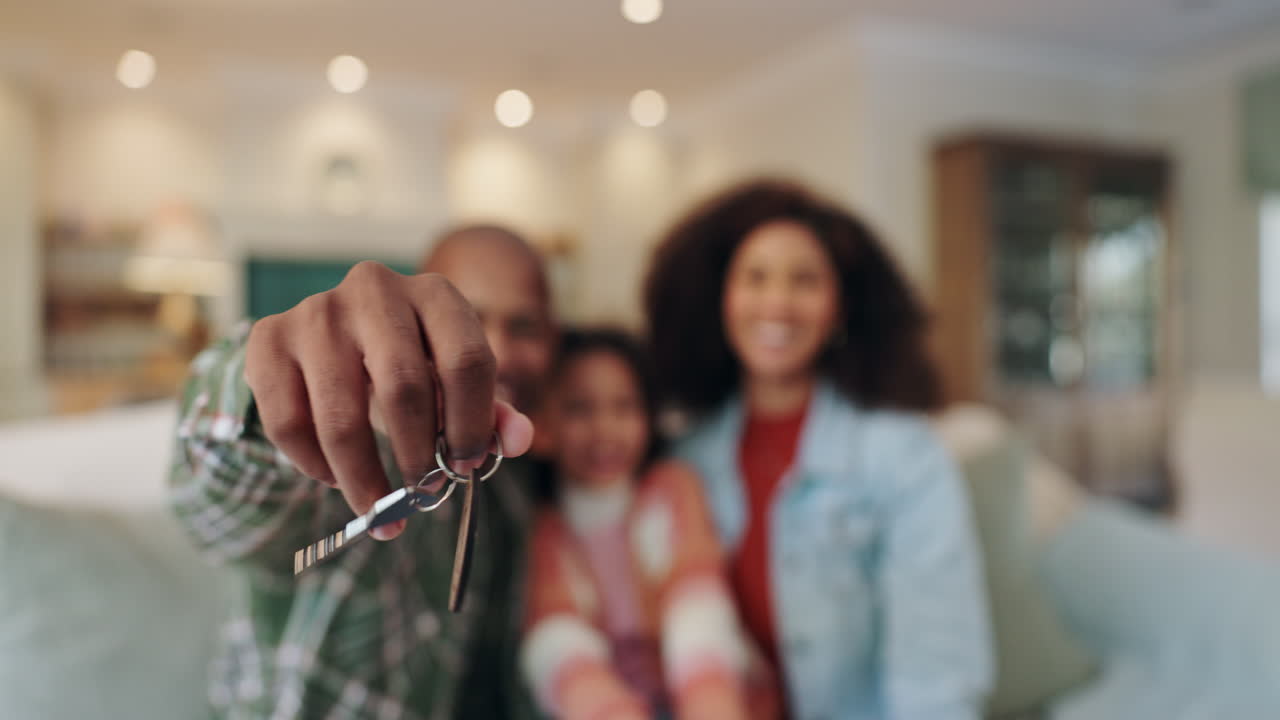 Happy family with keys to new home