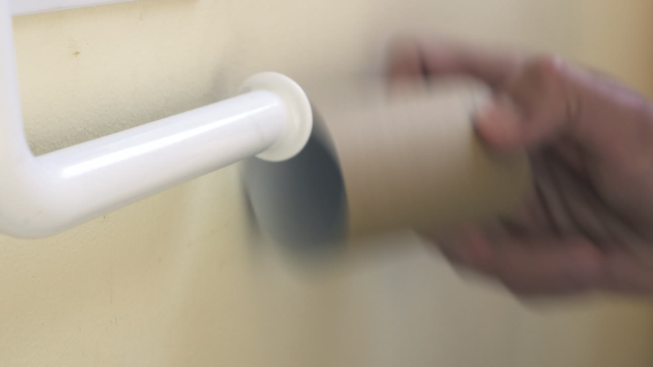 Person Uses Last Sheets Of Toilet Paper and Removes Roll, CLOSE UP