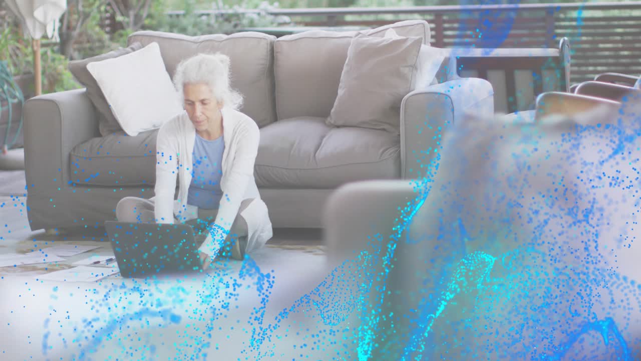 Senior woman reviewing laptop and alternating writing, typing in business, with animated overlays