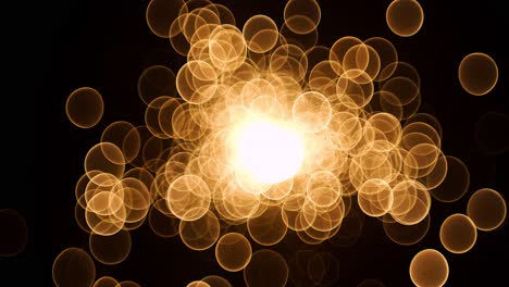 abstract glow gold bokeh bubble particles flying on black background. orange red gold bokeh particles dust fly in the air on super slow motion camera 1000 fps
