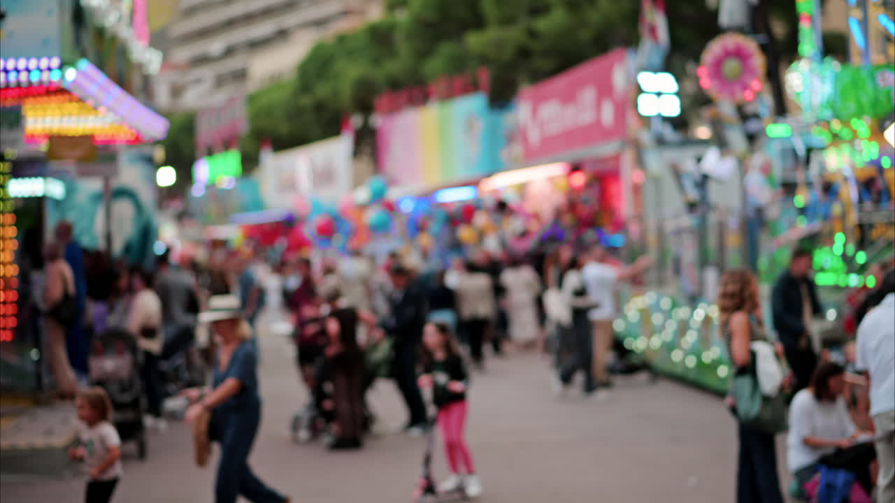 Blurry view of people at the attractions park in Nice, France