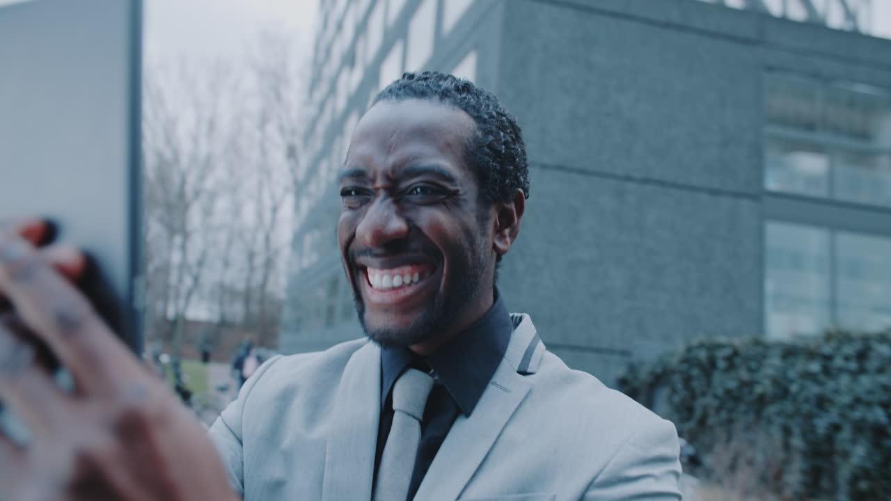 Businessman taking a selfie outside